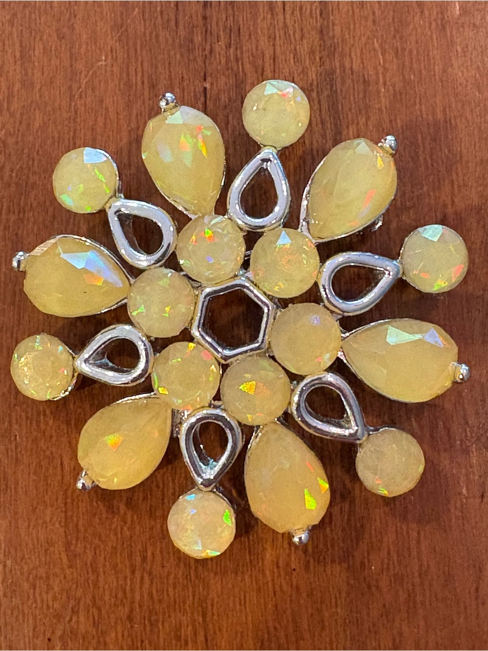 Vintage brooch/pin with silver tone and yellow stones.